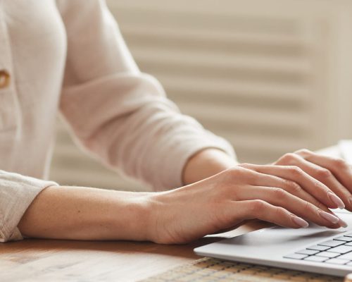 close-up-of-woman-typing-at-laptop-E3SQE3J.jpg