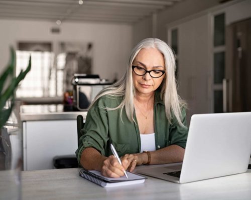 senior-fashionable-woman-working-at-home-PRY4EXQ.jpg